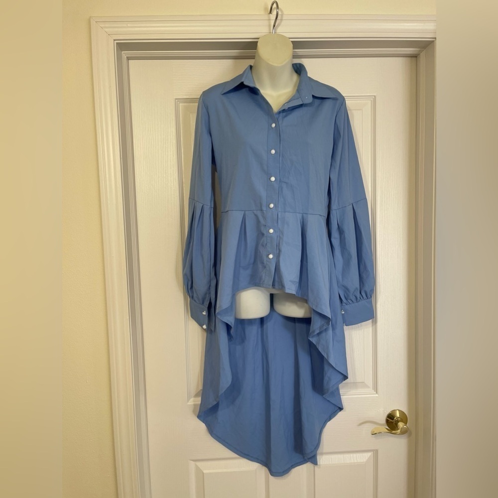 Statement making blue blouse size large​​​​​